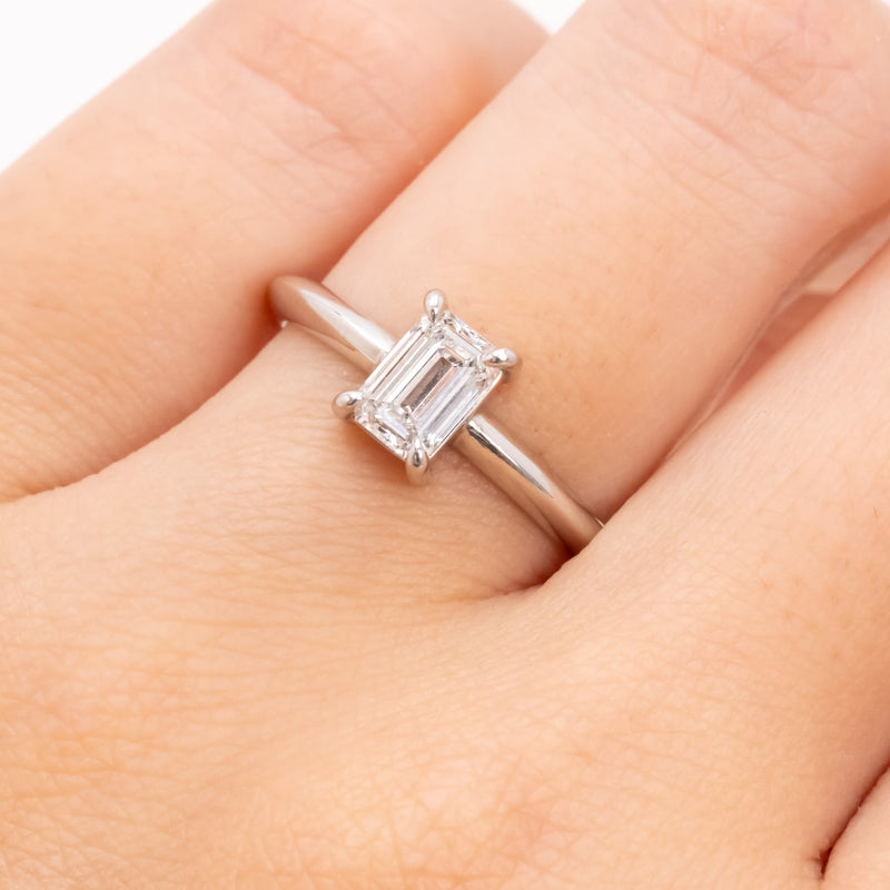 Emerald cut diamond knife edge ring