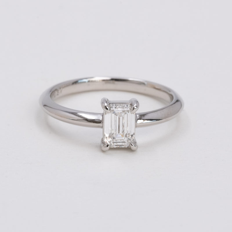 Emerald cut diamond knife edge ring