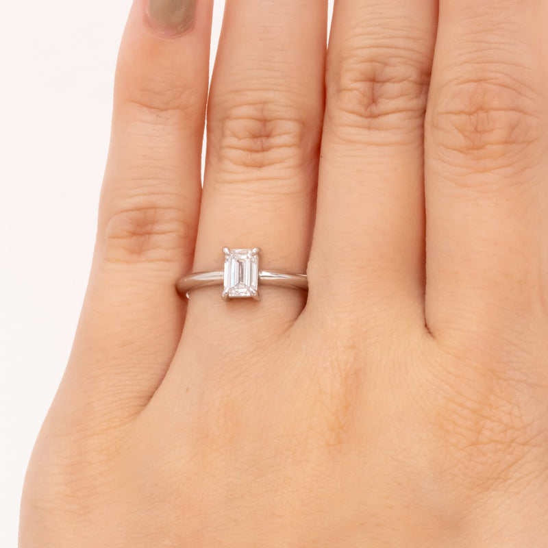 Emerald cut diamond knife edge ring