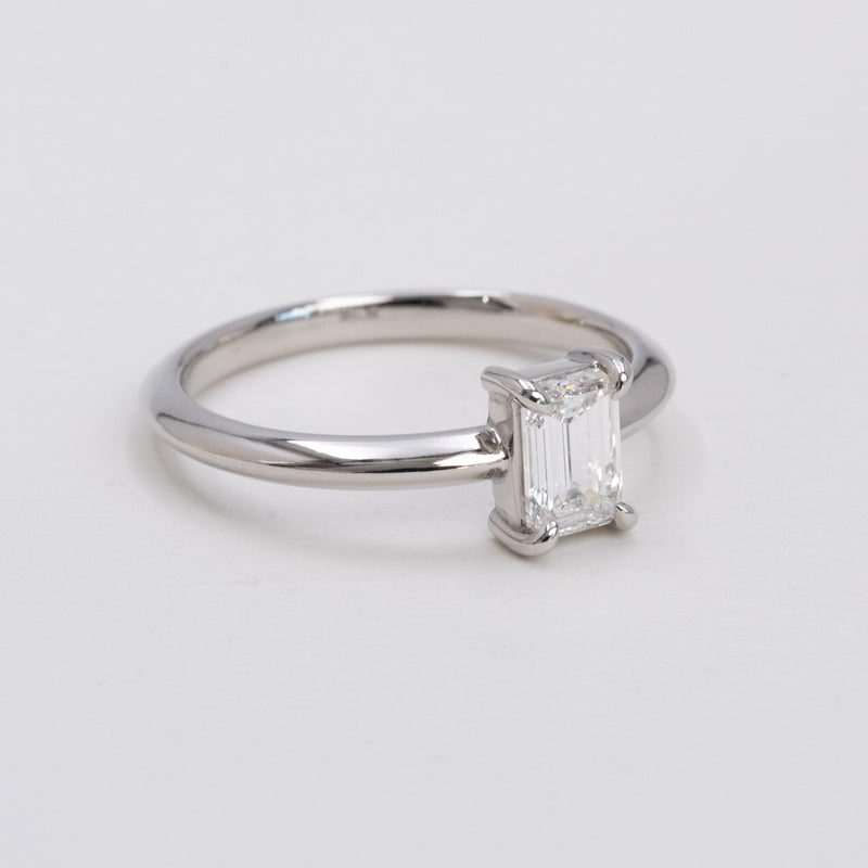 Emerald cut diamond knife edge ring