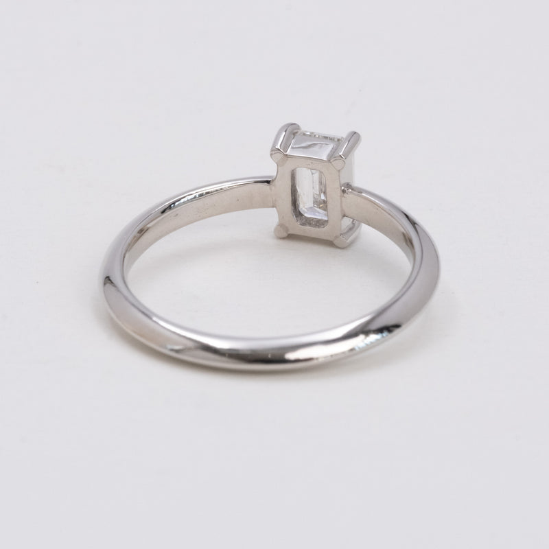 Emerald cut diamond knife edge ring