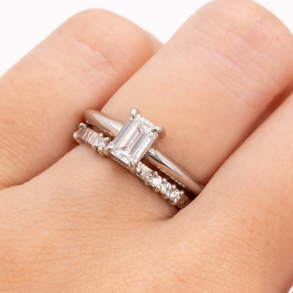 Emerald cut diamond knife edge ring