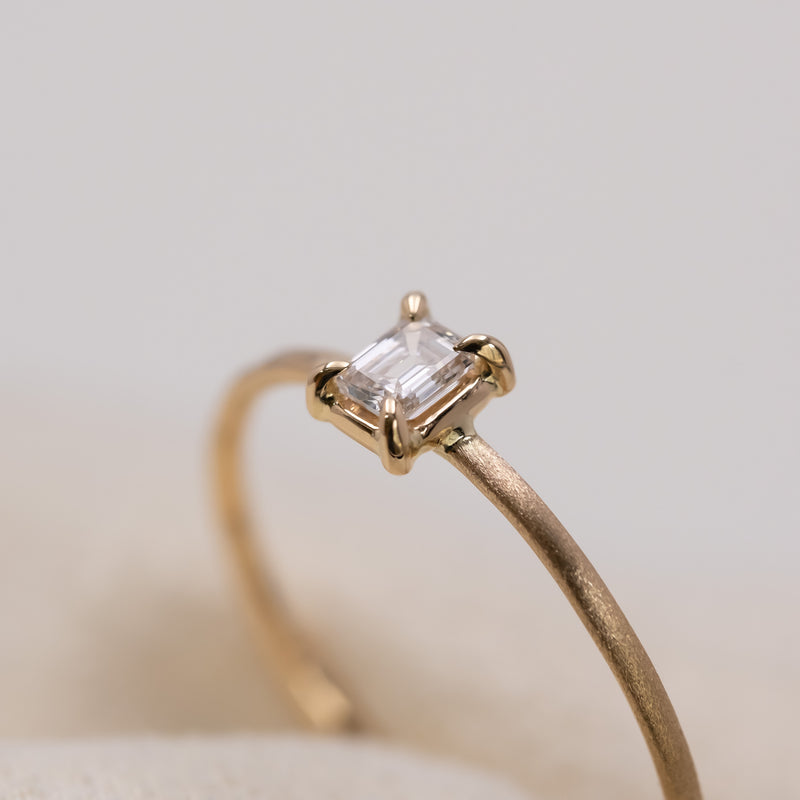 Emerald cut diamond harmony ring