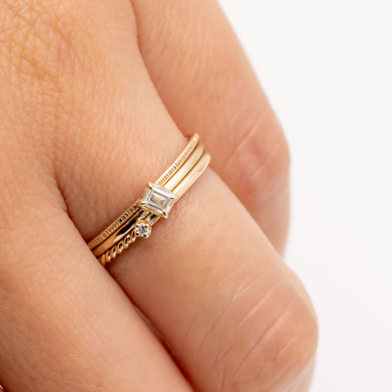 Emerald cut diamond harmony ring