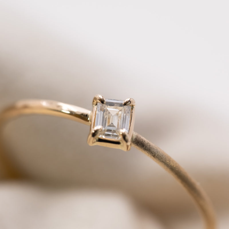 Emerald cut diamond harmony ring