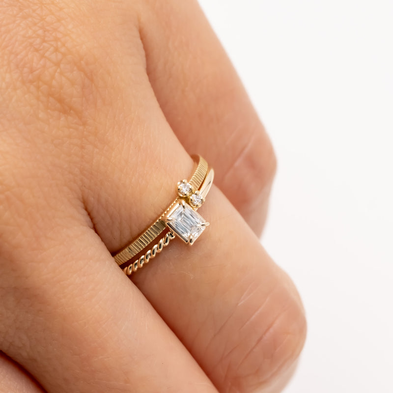 Emerald cut diamond harmony ring