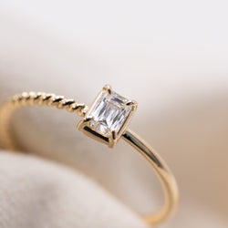 Emerald cut diamond harmony ring