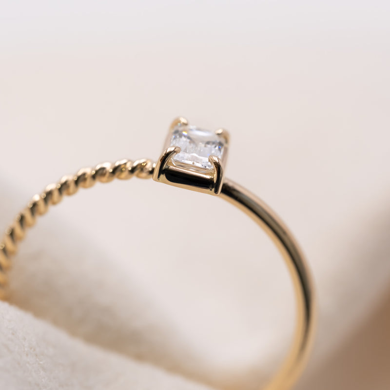 Emerald cut diamond harmony ring