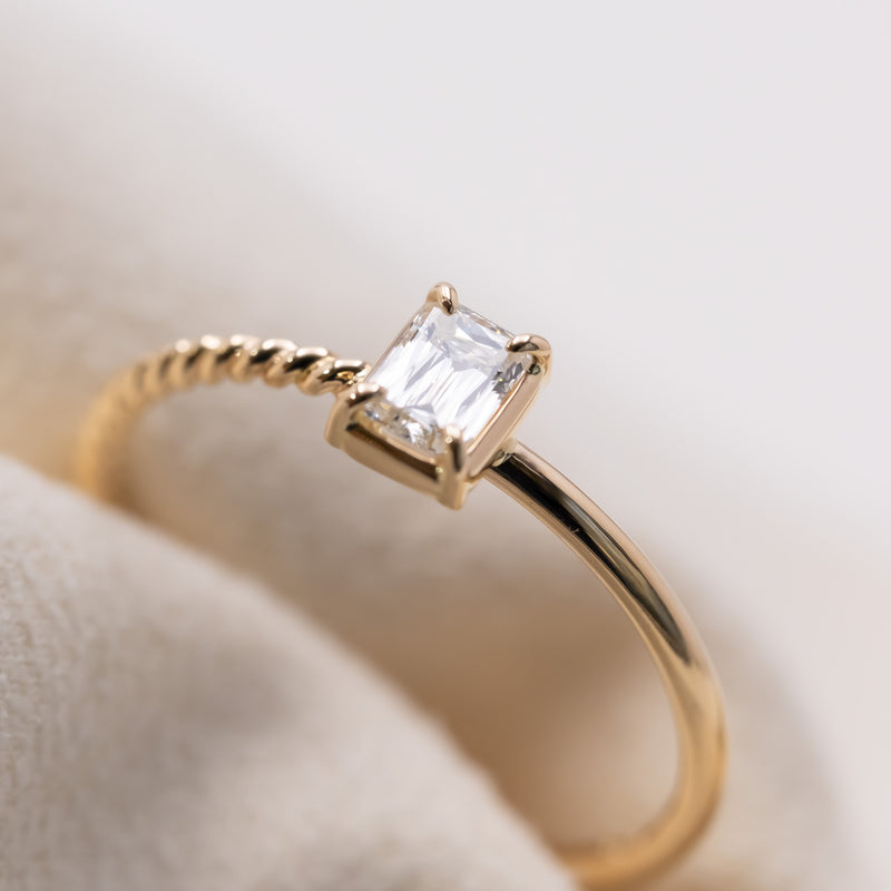 Emerald cut diamond harmony ring