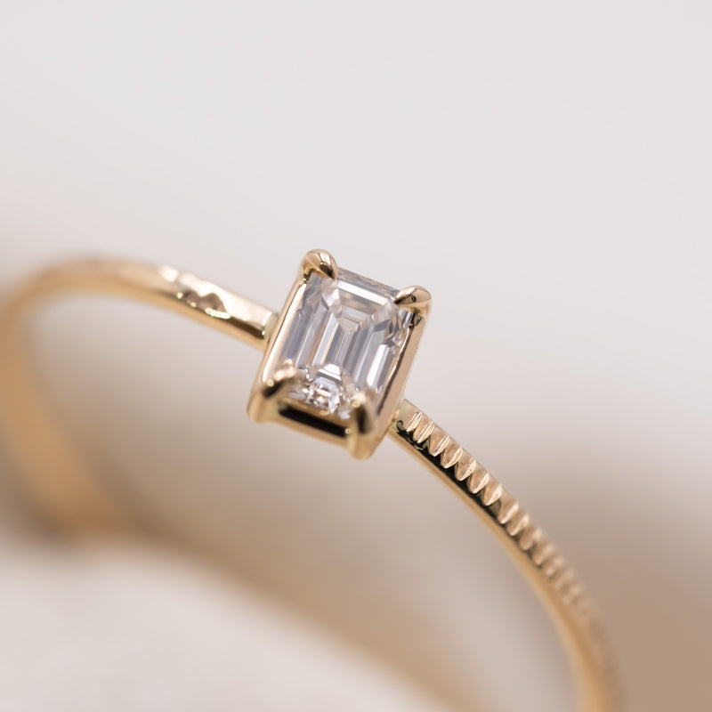 Emerald cut diamond harmony ring