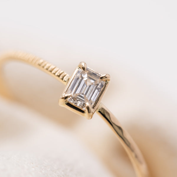 Emerald cut diamond harmony ring