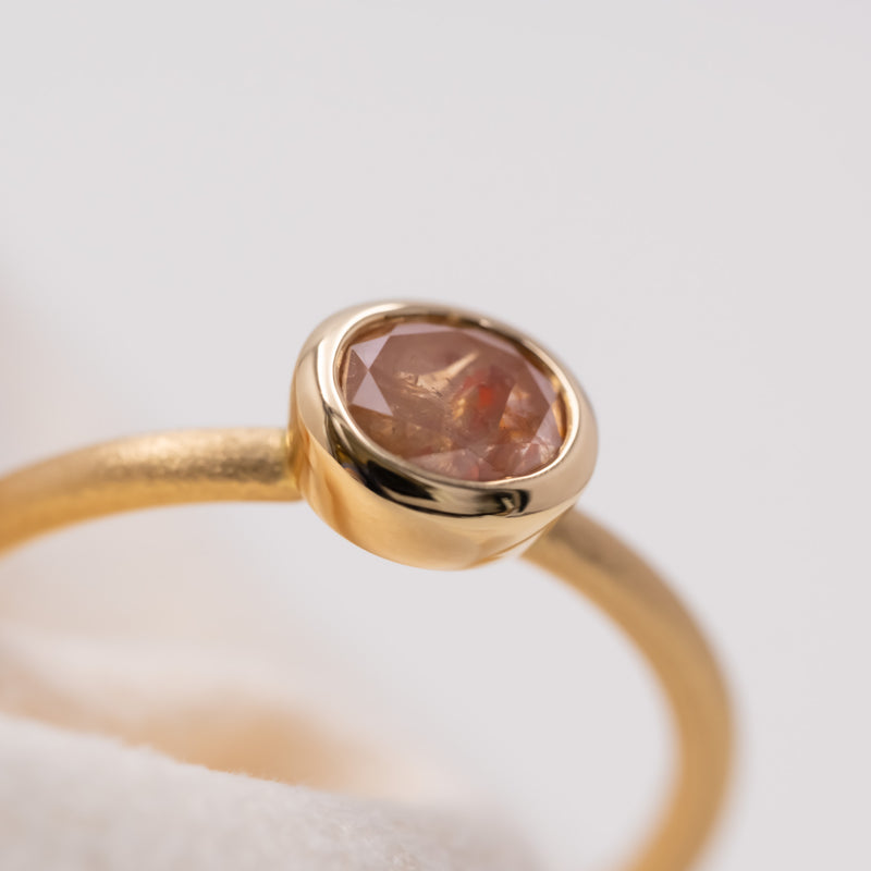 Peach oval diamond ring